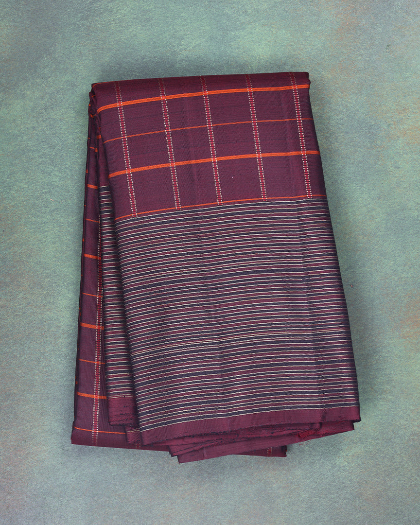  A handloom kanchipuram silk saree with thick checks on the body and traditional seer border